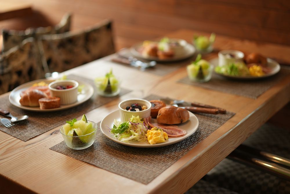 Breakfast laid along the long timber table